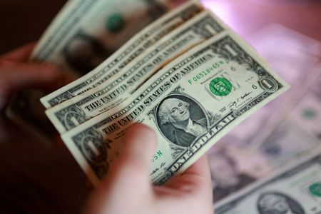 Dollar hits one-month high on lingering chances of Fed hike