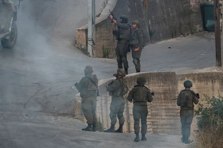 Israeli military cracks down on West Bank village as settlers march in