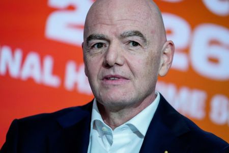 Soccer-Reaction to FIFA backing down on World Cup sell-off plans
