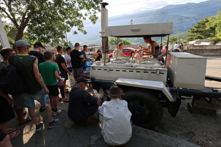 Crimean families queue for hot meals as Ukraine hits power supply
