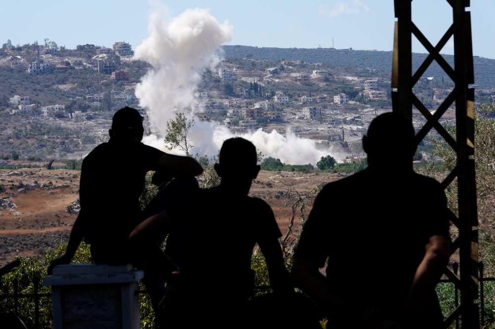 Residents of southern Lebanon gather to watch Israeli drones drop explosives on their village