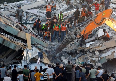 War-damaged Gaza building collapses, killing 20 people sheltering inside