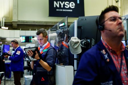 Wall St falls at open as Alphabet results reignite AI spending fears